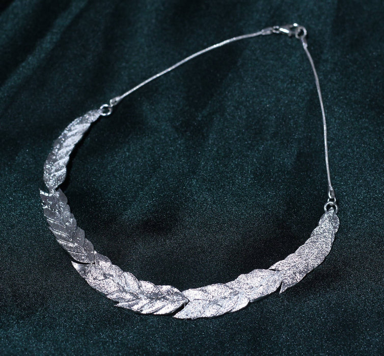 Sterling silver articulated leaf themed necklace